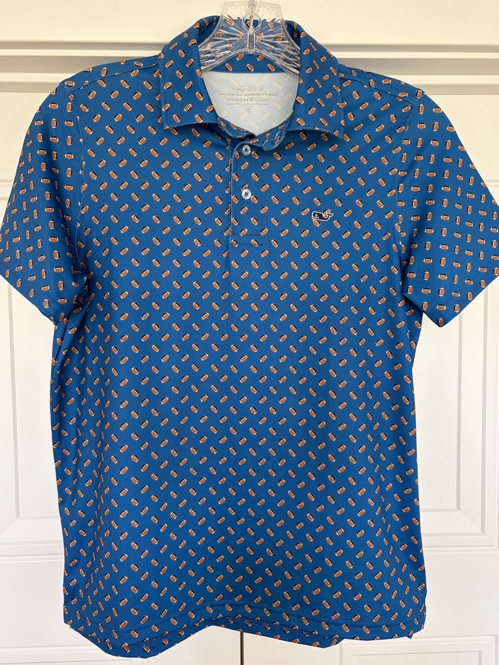Boys Vineyard Vines Blue Polo with all over football print. Size large